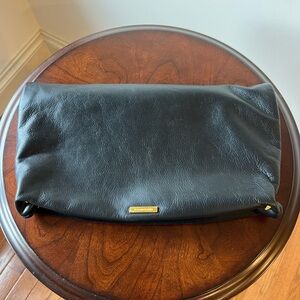 BCBGMaxAzria Black Fold-Over Clutch with Gold Accent
